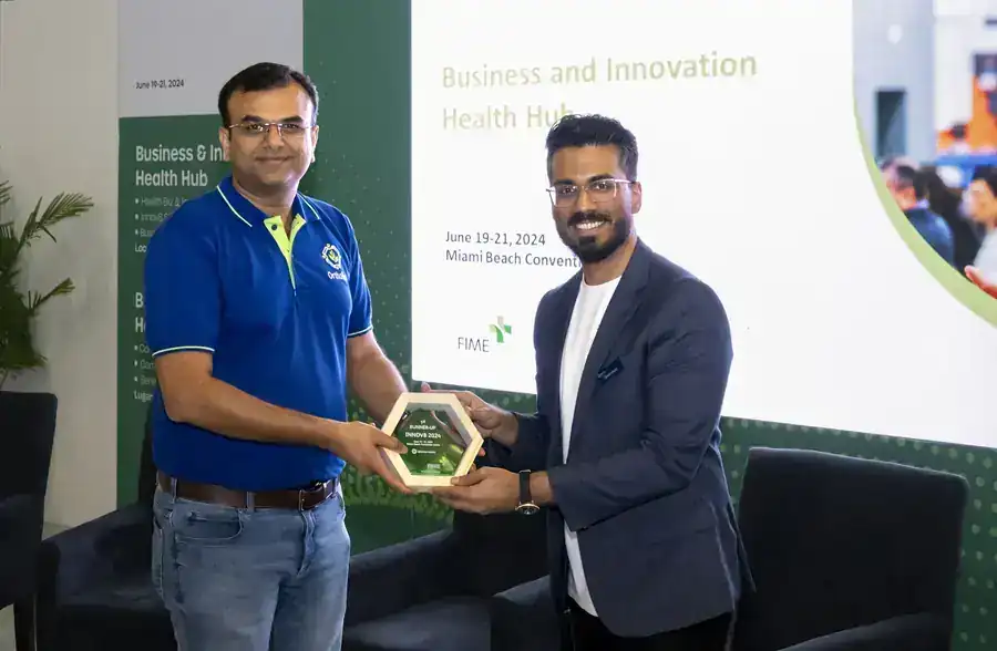 Dr Pankaj Chhatrala receiving an award at FIME 2024