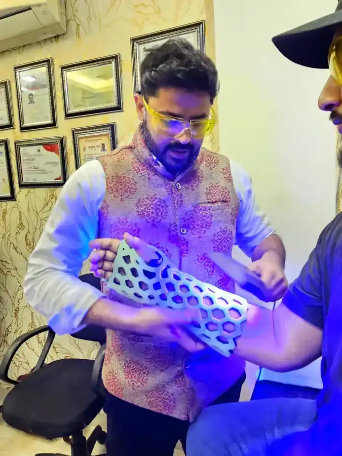 Surgeon curing a FlexiOH immobilizer in an Indian clinic
