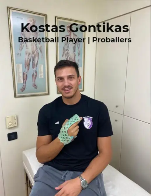Kostas Gontikas, professional basketball player, wearing a FlexiOH short arm immobilizer